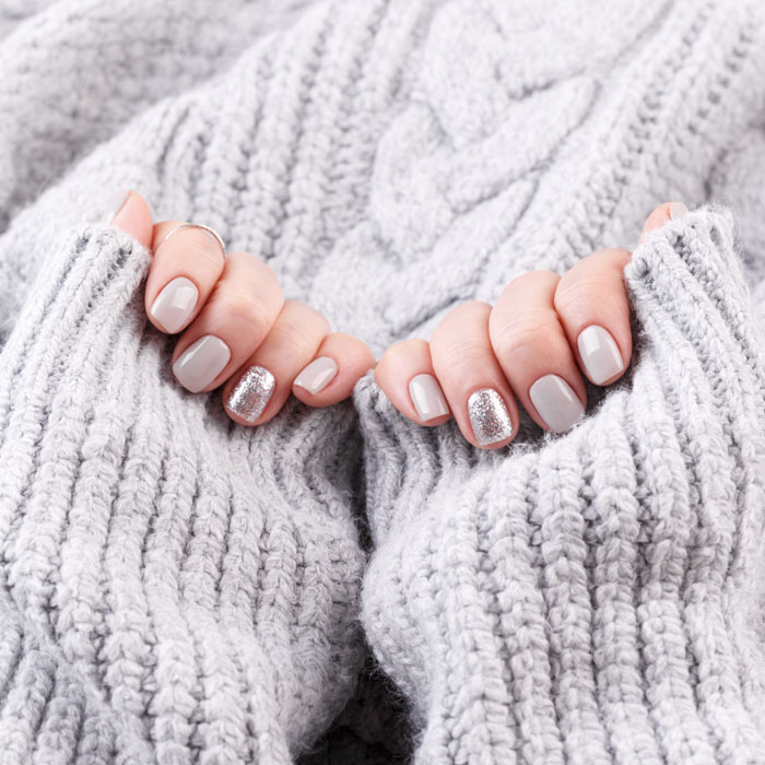 manicured-woman-hands-with-pastel-nail-polish